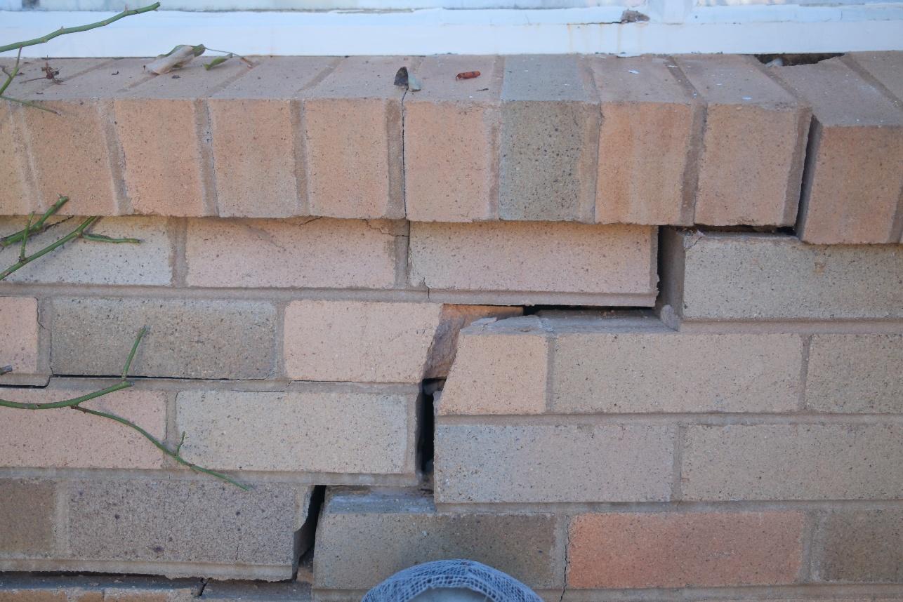 Displaced brick masonry following a vehicle impact